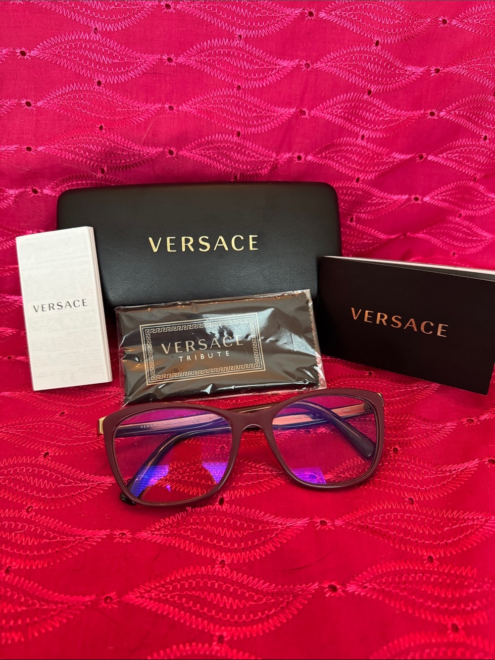 Versace Burgundy Frame Glasses with Purple Lens Reflection